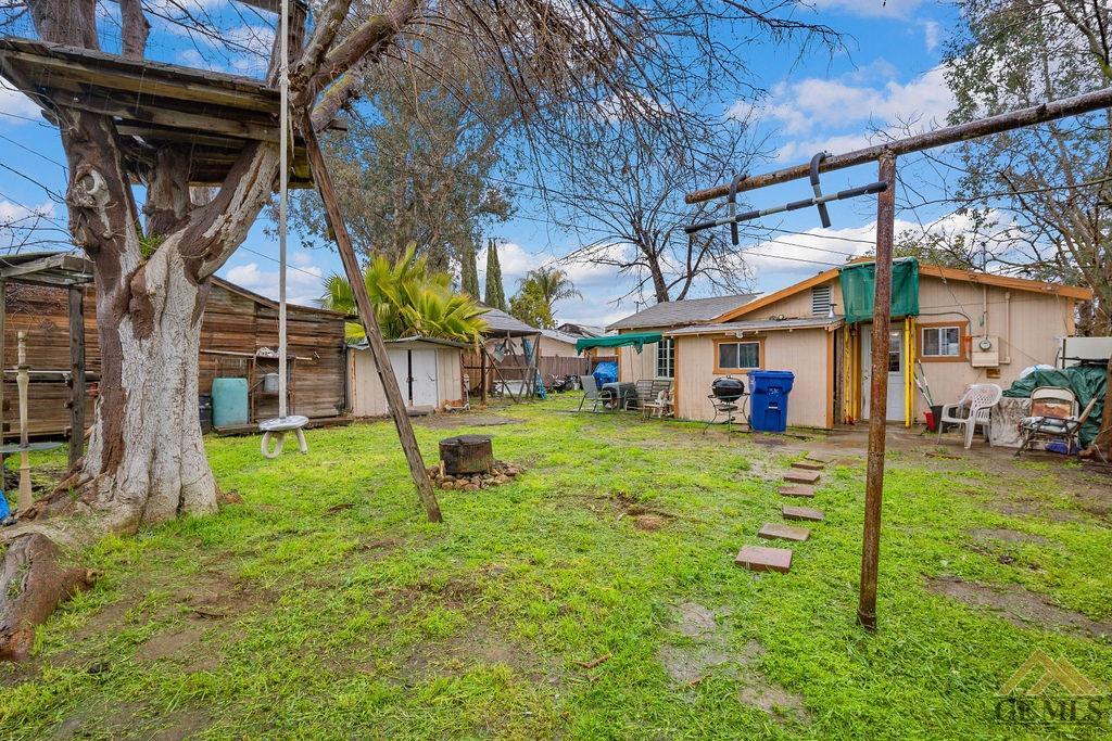 Undisclosed Address Wasco, CA 93280 - Photo 25 of 29 a view of a house with a yard