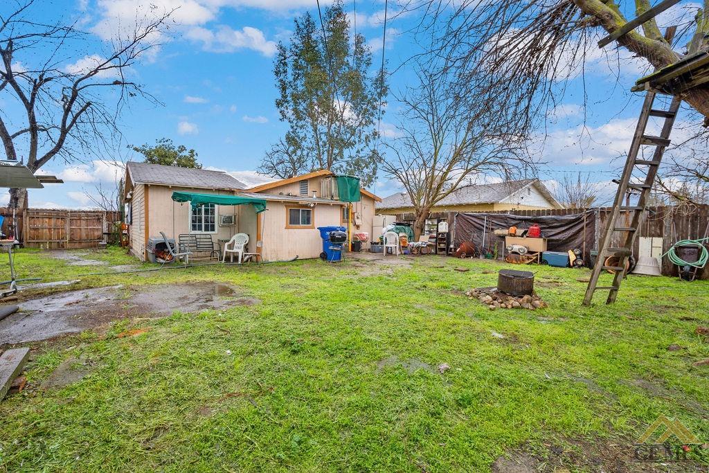 Undisclosed Address Wasco, CA 93280 - Photo 26 of 29 a view of a yard with table and chairs and a big yard