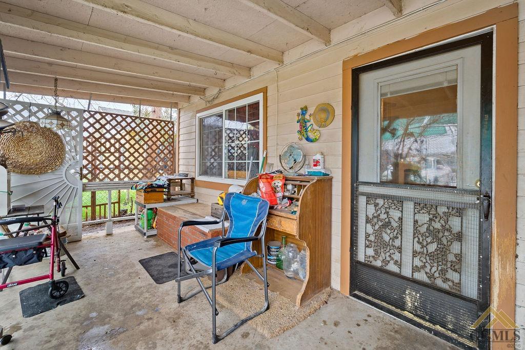 Undisclosed Address Wasco, CA 93280 - Photo 3 of 29 a outdoor living space with furniture and a painting on the wall