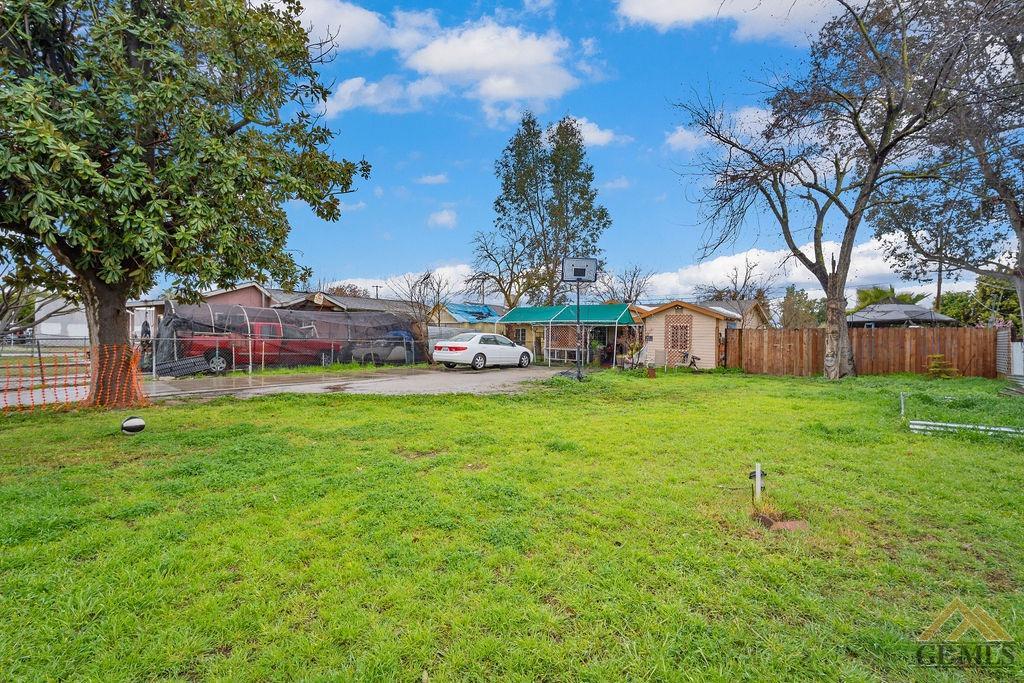 Undisclosed Address Wasco, CA 93280 - Photo 5 of 29 a green field with lots of trees in the background
