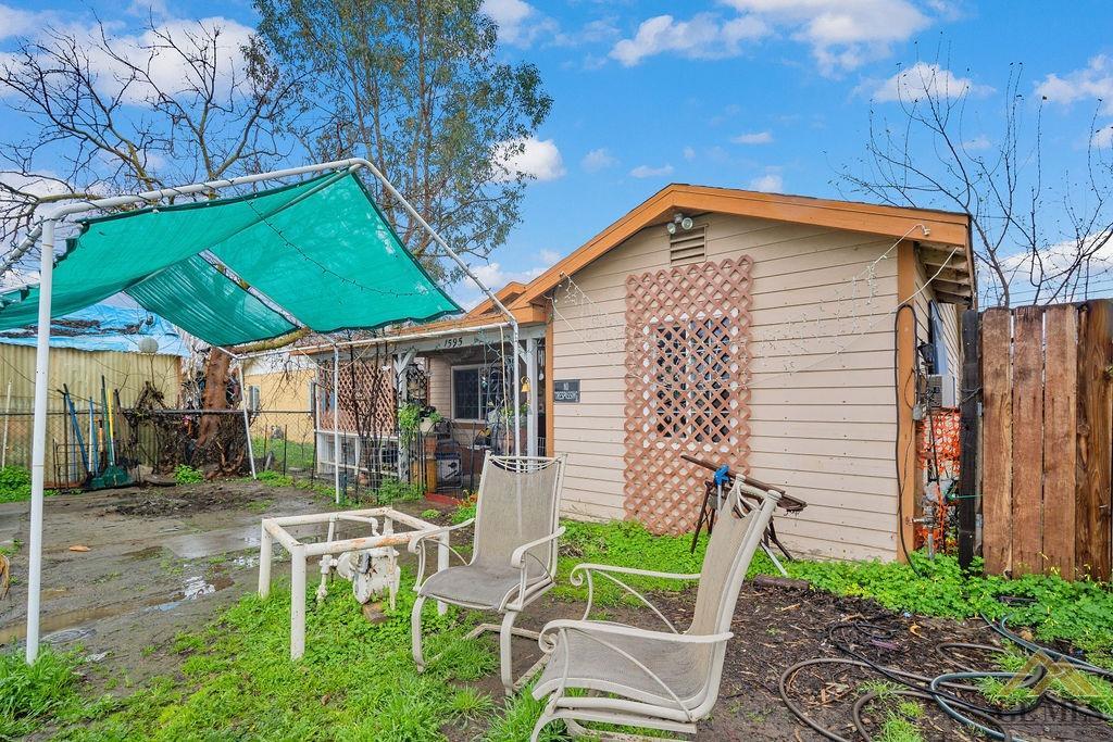 Undisclosed Address Wasco, CA 93280 - Photo 8 of 29 a view of backyard with outdoor seating and green space