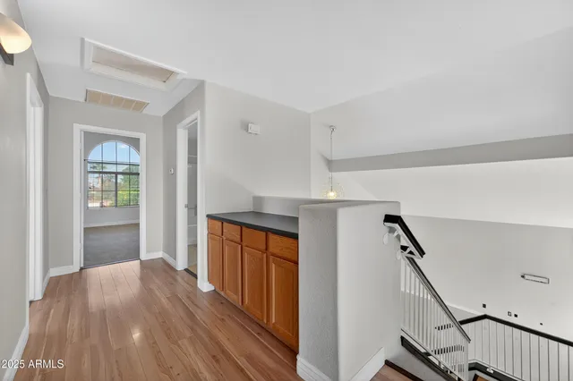 a kitchen with stainless steel appliances a refrigerator and a stove