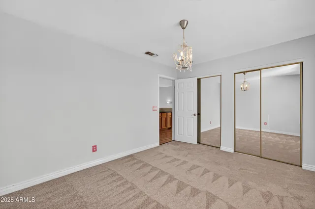 a view of a bathroom with tub shower and windows