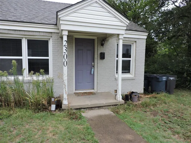 a view of front door and yard