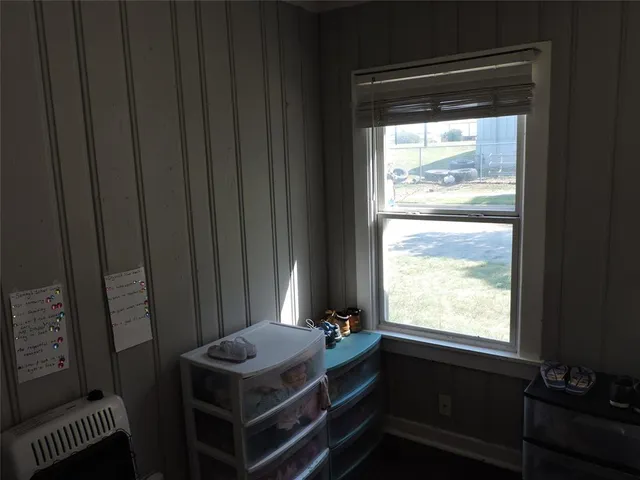 a room that has a window and a wooden floor