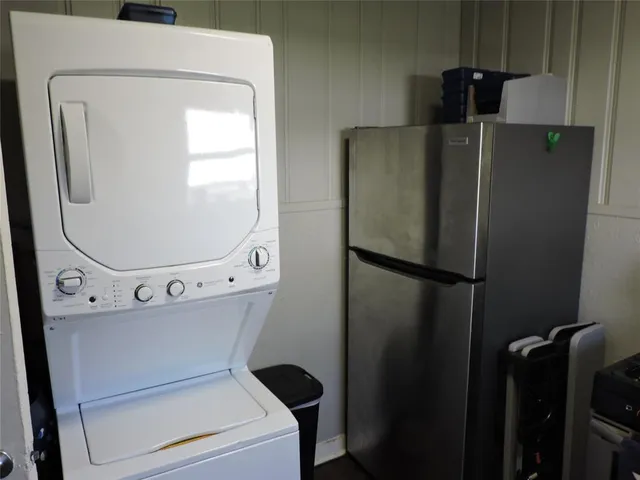 a close view of a utility room with dryer and washer
