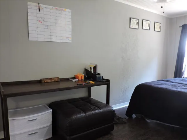 a bedroom with a bed and cabinets