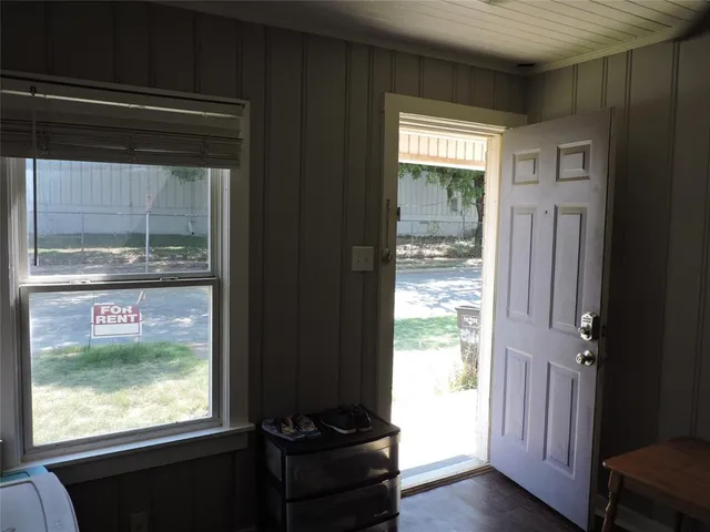 a view of a wooden floor and a window