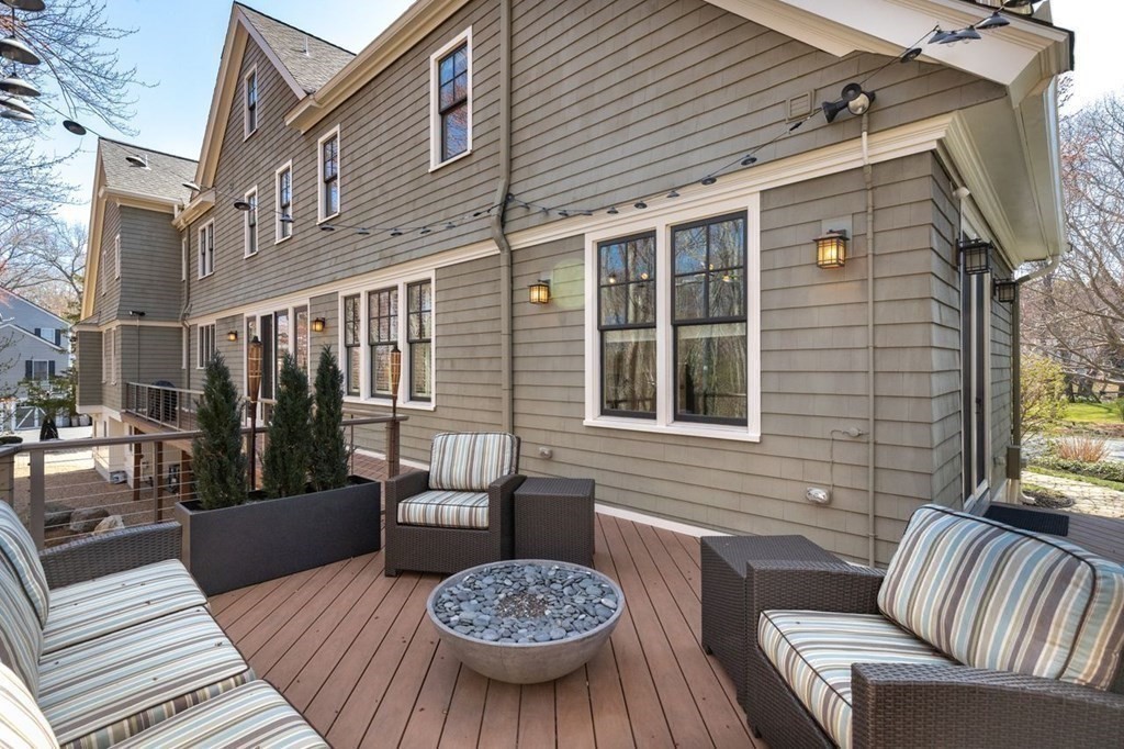 3 Solomon Pierce Road Lexington, MA 02420 - Photo 16 of 18 a view of a patio with couches table and chairs and wooden floor