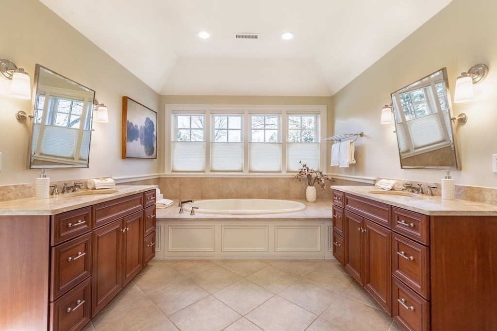 3 Solomon Pierce Road Lexington, MA 02420 - Photo 10 of 18 a spacious bathroom with a granite countertop tub sink shower and mirror