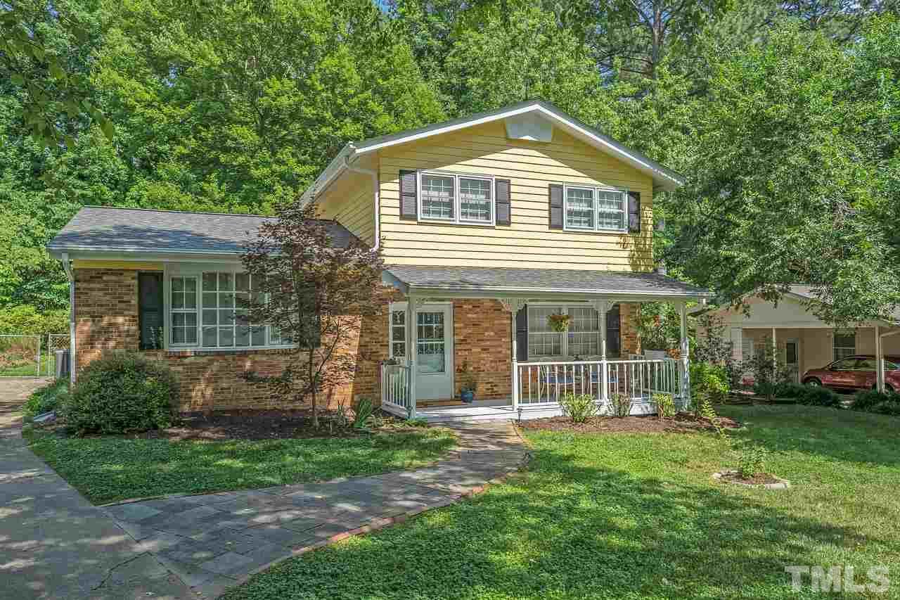505 Old Farm Road Raleigh, NC 27606 - Photo 2 of 22 a front view of a house with a garden