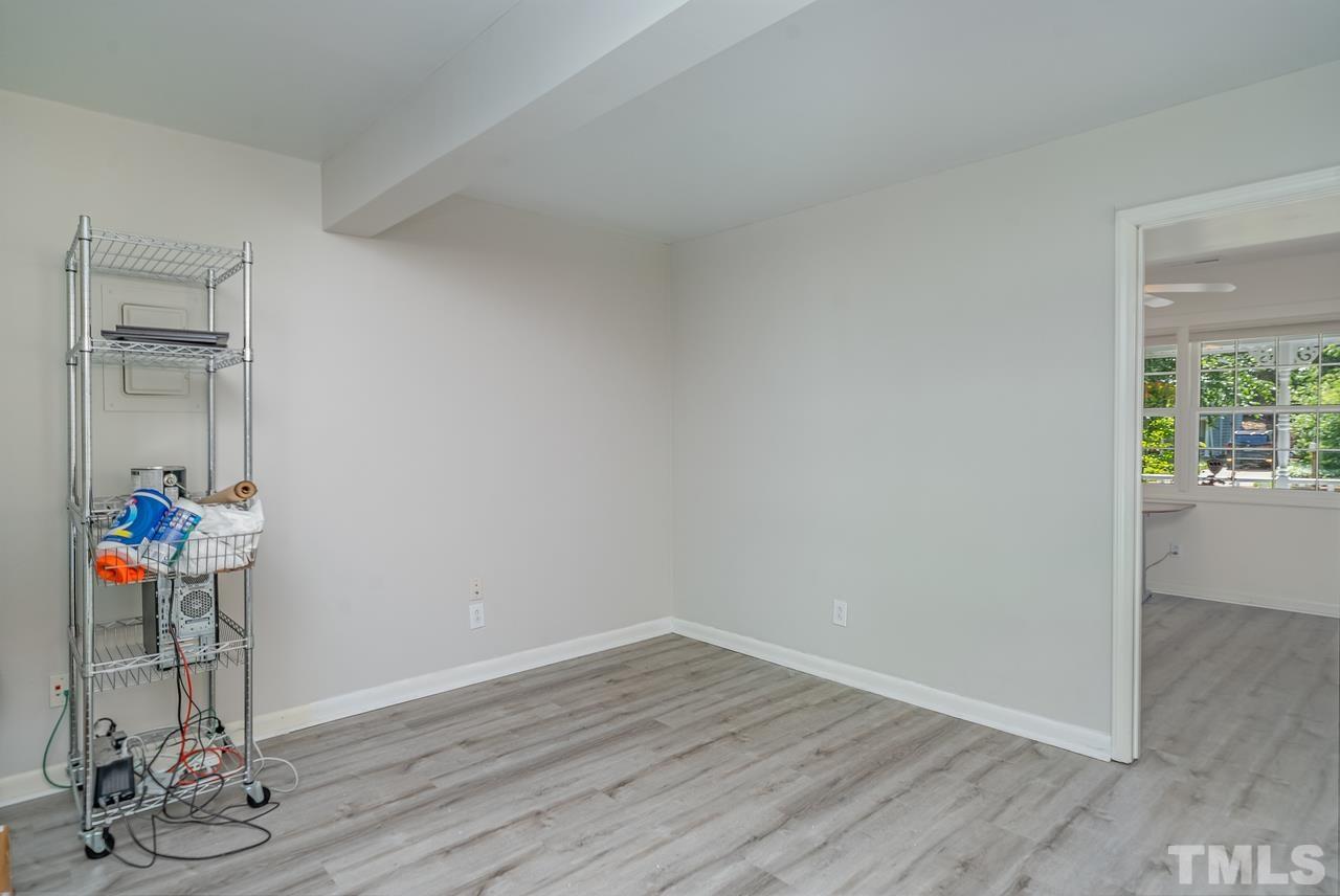 505 Old Farm Road Raleigh, NC 27606 - Photo 12 of 22 a view of a room with wooden floor and gym equipment