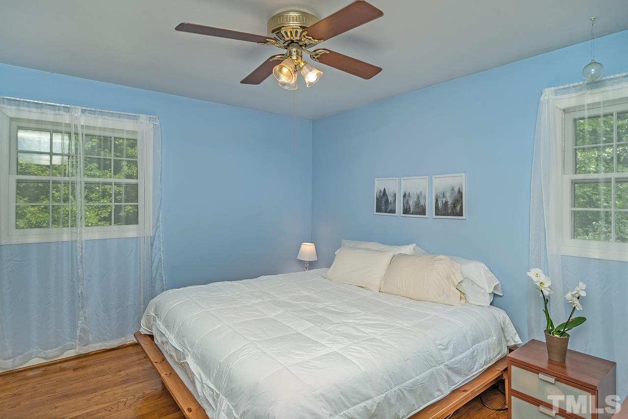 505 Old Farm Road Raleigh, NC 27606 - Photo 16 of 22 a bedroom with a bed and a window