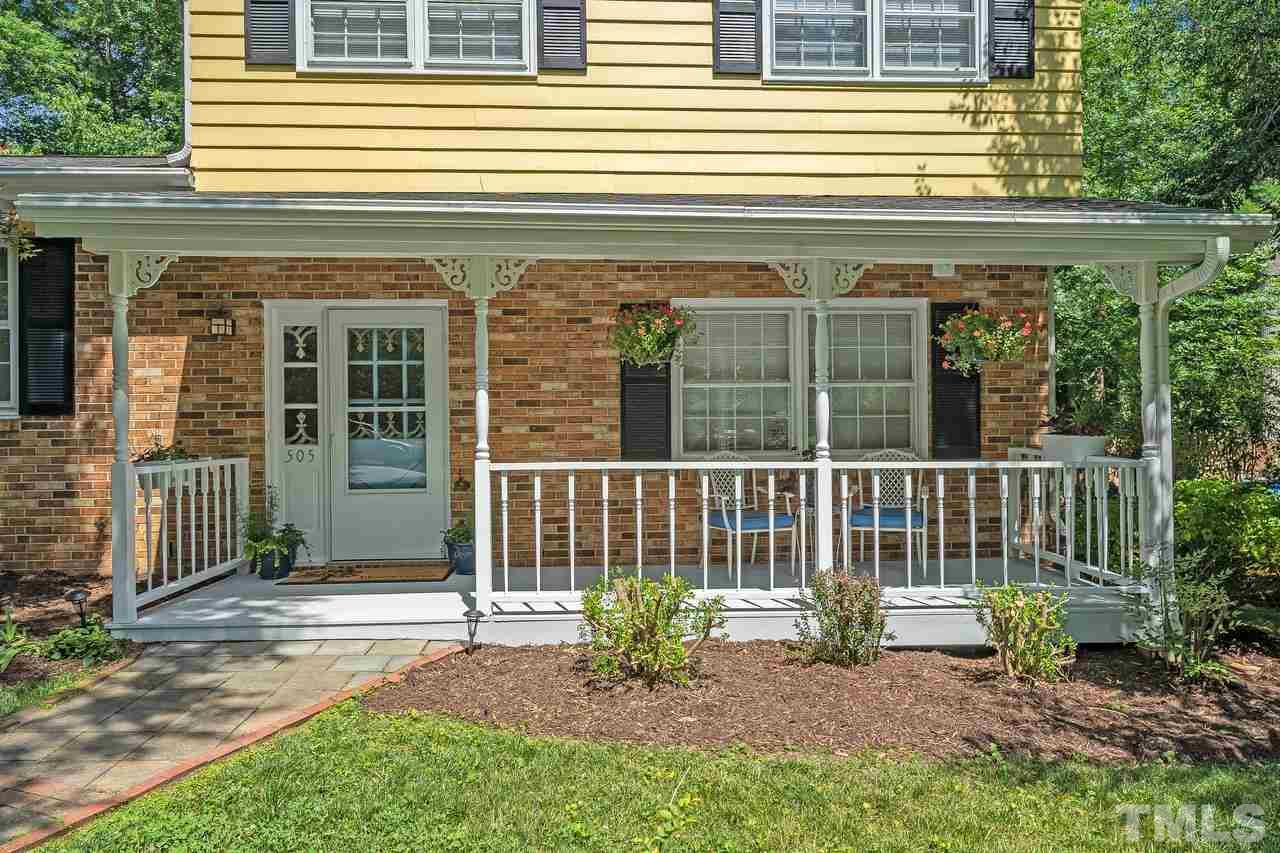 505 Old Farm Road Raleigh, NC 27606 - Photo 3 of 22 a view of a house with a small deck and a garden