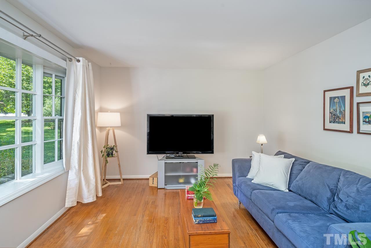 505 Old Farm Road Raleigh, NC 27606 - Photo 5 of 22 a living room with furniture and a flat screen tv