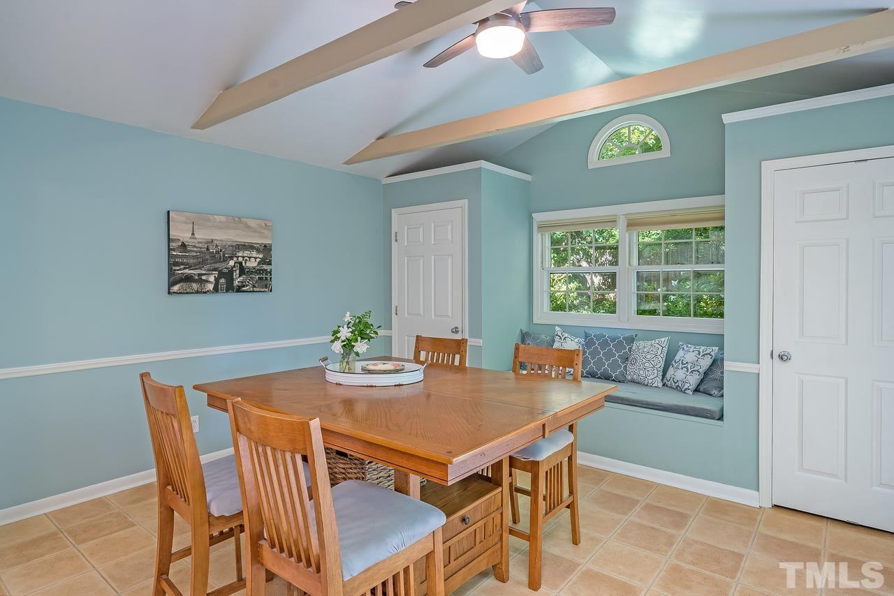 505 Old Farm Road Raleigh, NC 27606 - Photo 8 of 22 a view of a dining room with furniture and a window