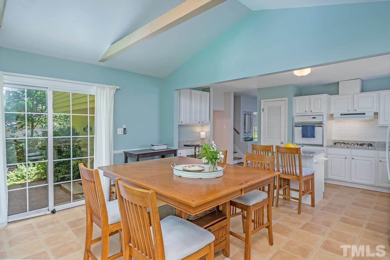 505 Old Farm Road Raleigh, NC 27606 - Photo 9 of 22 a view of a dining room with furniture window and outside view