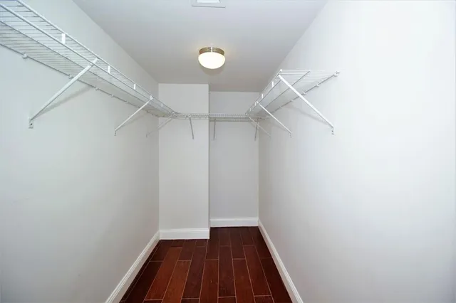 a bathroom with a double vanity sink toilet and shower