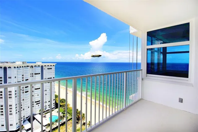a view of hallway with a large kitchen space