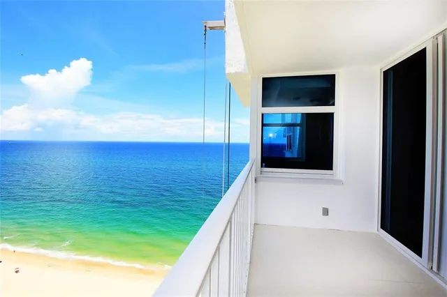a view of an empty room and many windows