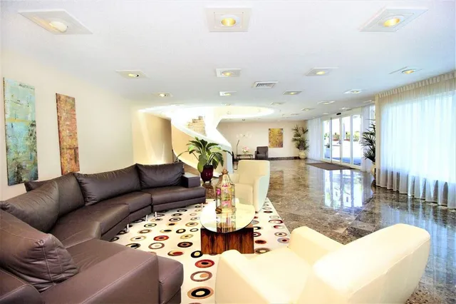 a view of swimming pool with outdoor seating