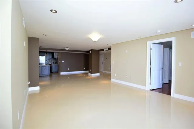 a view of a room with a kitchen