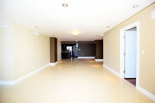 a view of a living room with a large window