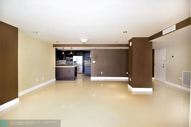 a view of a kitchen with a sink