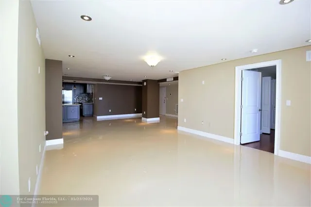 a view of a livingroom with furniture and a window
