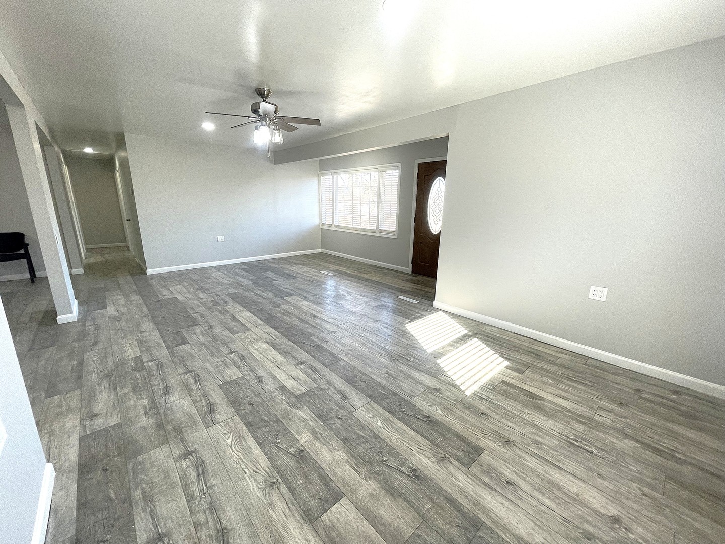 16058 South Gougar Road Homer Glen, IL 60491 - Photo 12 of 25 a view of empty room with wooden floor and fan