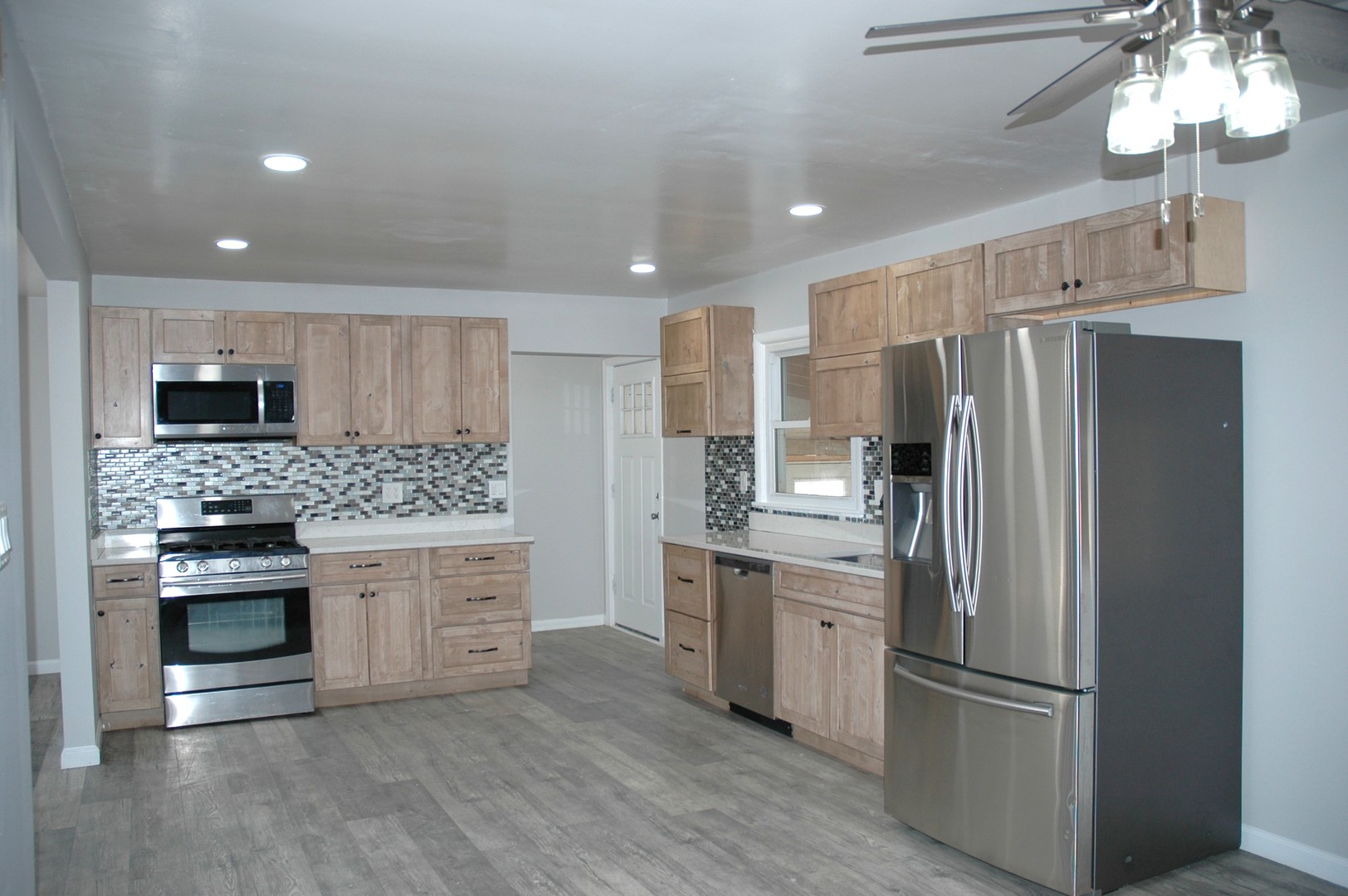 16058 South Gougar Road Homer Glen, IL 60491 - Photo 6 of 25 a kitchen with stainless steel appliances a refrigerator sink and microwave