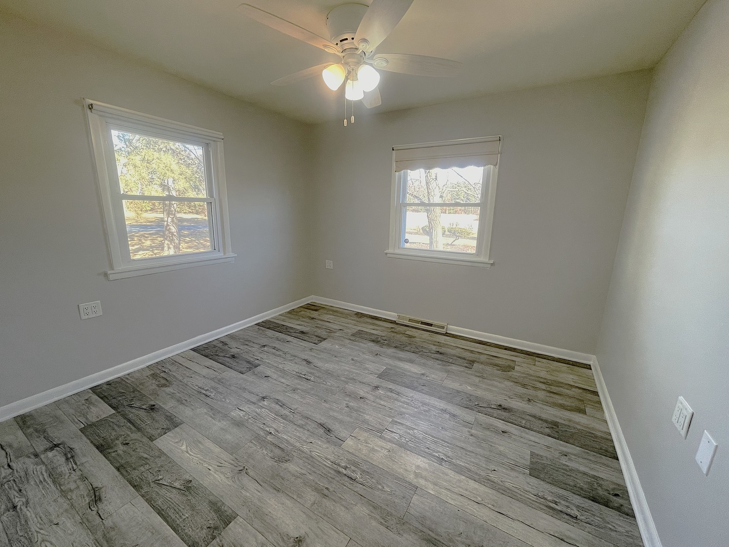 16058 South Gougar Road Homer Glen, IL 60491 - Photo 7 of 25 a view of empty room with wooden floor and fan