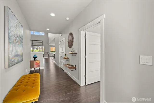 a bed sitting in a bedroom next to a window