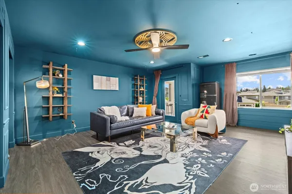 a living room with furniture and a large window