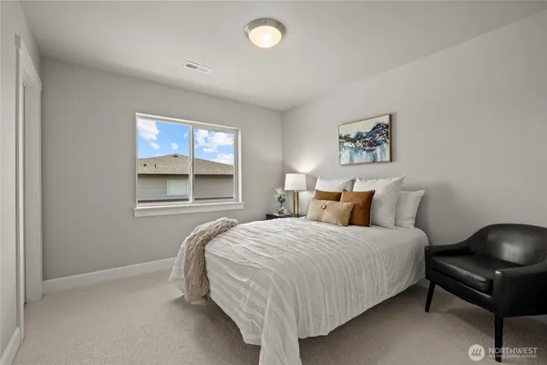 a bedroom with a bed and window