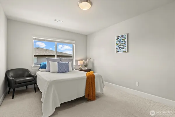 a bedroom with a bed and window