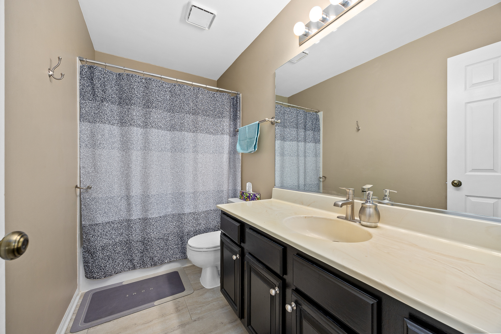 2 Buckboard Court Bolingbrook, IL 60490 - Photo 25 of 33 a bathroom with a sink a toilet a shower and a mirror