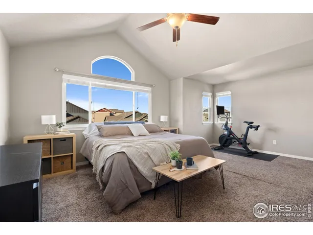 a bedroom with a bed and a cabinet