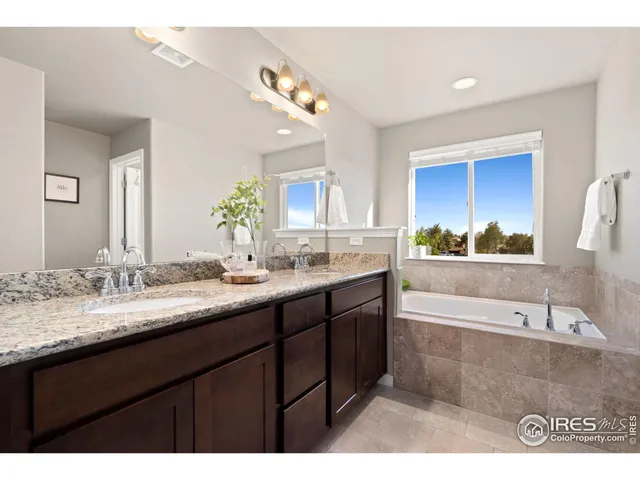 a bathroom with a shower and a sink