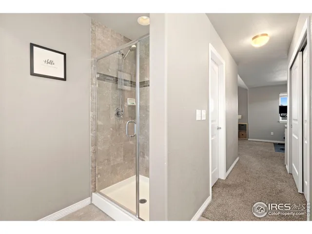 a bedroom with a bed a desk and chair