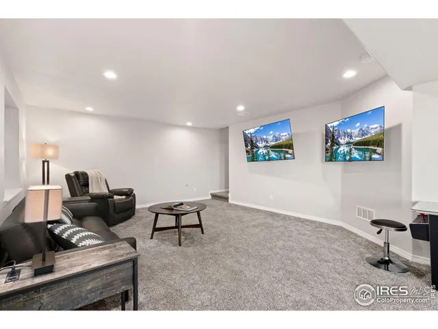 a kitchen with a dining table chairs and white cabinets