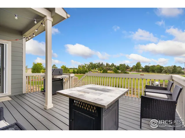 a living room with furniture a window and a table