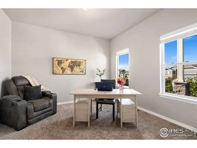 a bathroom with a granite countertop toilet sink and mirror
