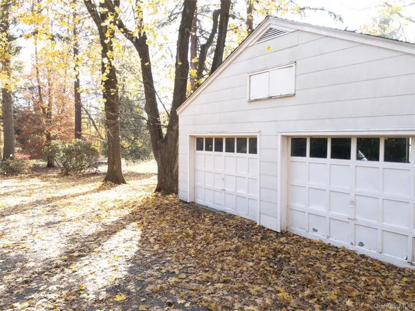 a backyard of a house with large trees