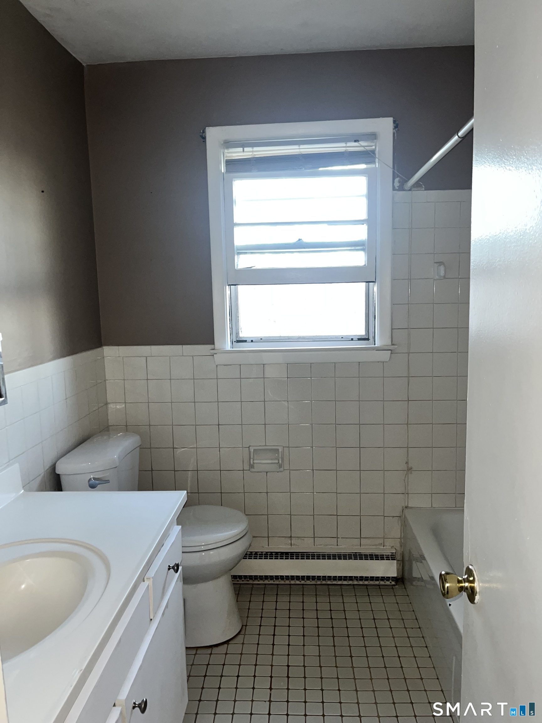 1730 State Street, Unit 407 Hamden, CT 06517 - Photo 5 of 8 a bathroom with a sink a toilet and a shower