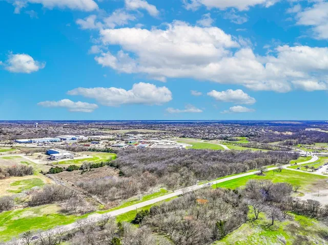 a view of a swimming pool with a yard