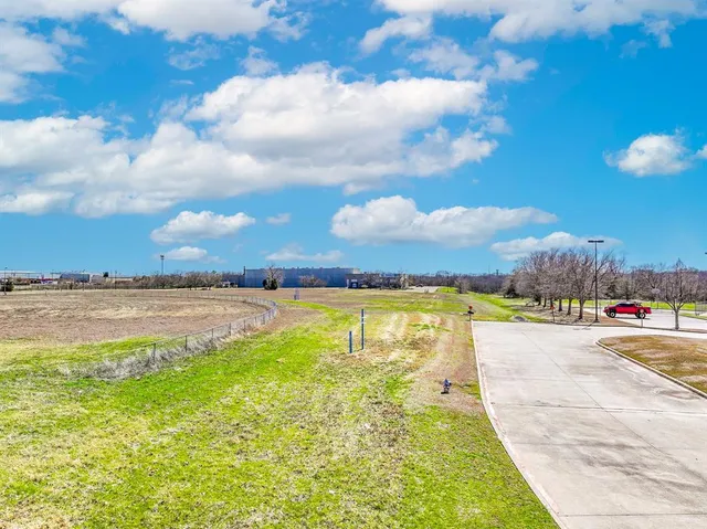 a view of a swimming pool and an outdoor seating