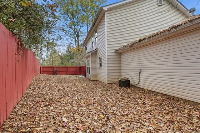 a view of a backyard with a large tree