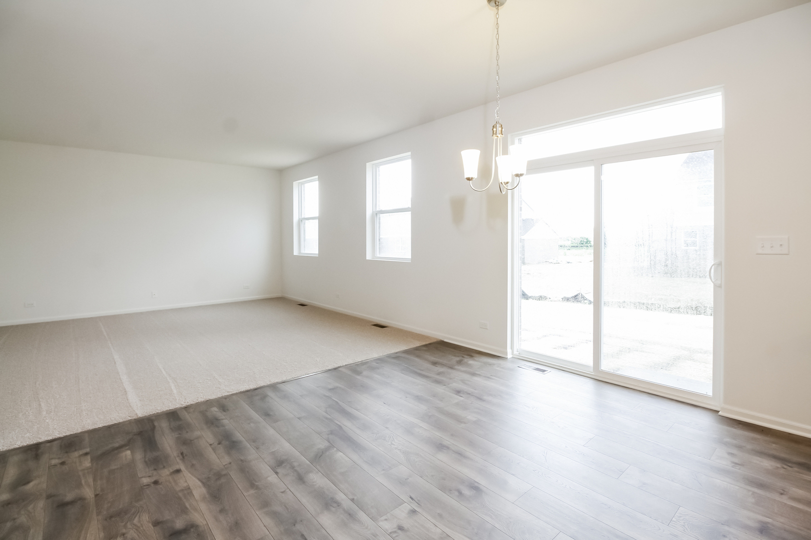 1994 Stapleton Road New Lenox, IL 60451 - Photo 6 of 16 an empty room with wooden floor and windows