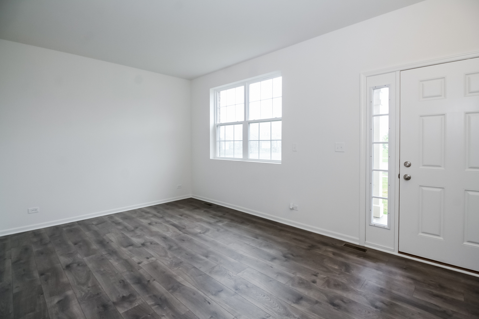 1994 Stapleton Road New Lenox, IL 60451 - Photo 8 of 16 an empty room with wooden floor and windows